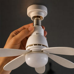 Hand screwing the ceiling fan light into a standard E27 socket